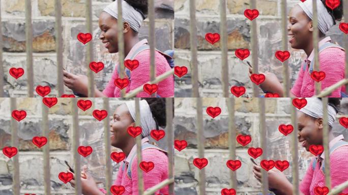 在城市中使用智能手机在快乐的非洲裔美国妇女上的红心气球动画