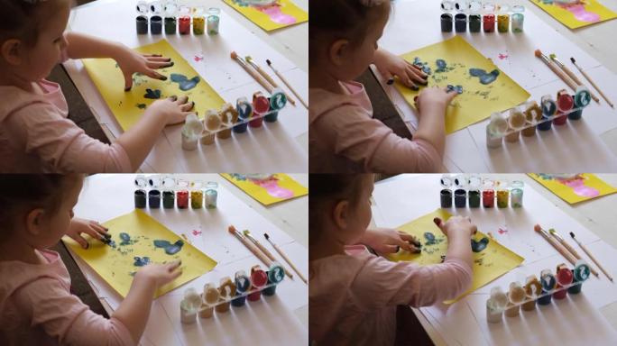 儿童用手指绘画。用指画绘画的想法。儿童发展。快乐童年的概念