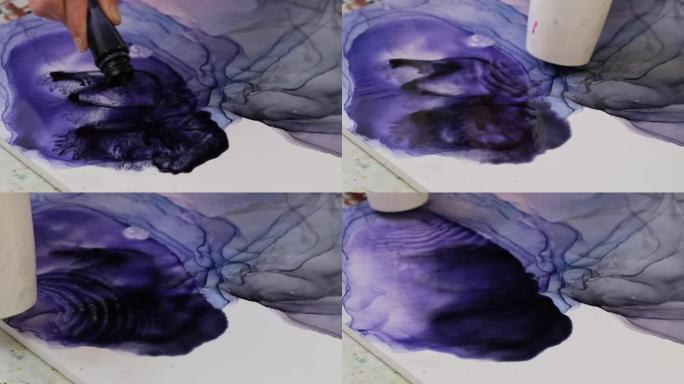 艺术家用墨水绘制抽象。吹风机模糊睫毛膏创建抽象图画