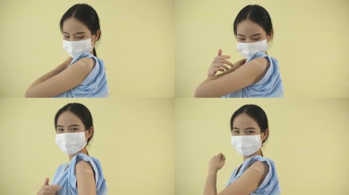 接种疫苗后，亚洲女孩在绷带上指指点点