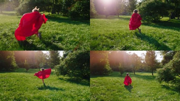 在公园中央的镜头前，一个可爱的小男孩穿着超级英雄套装快速奔跑