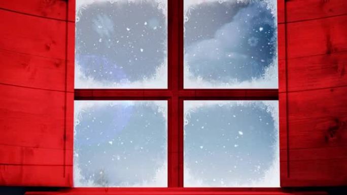 窗框抵御雪落在蓝色的圣诞节小玩意