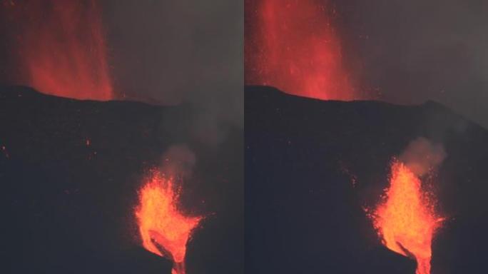 拉帕尔玛火山在黄昏爆发，熔岩流流动。惊人的声音!