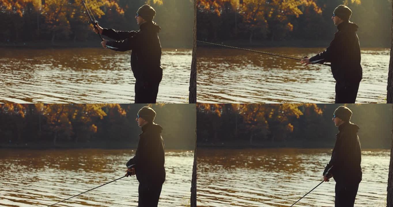 在阳光明媚的秋日，渔夫将纺纱杆投入湖中。引诱钓鱼