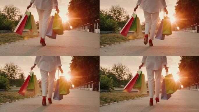 一个穿着红色鞋子的女人背着时髦的购物袋。后视图