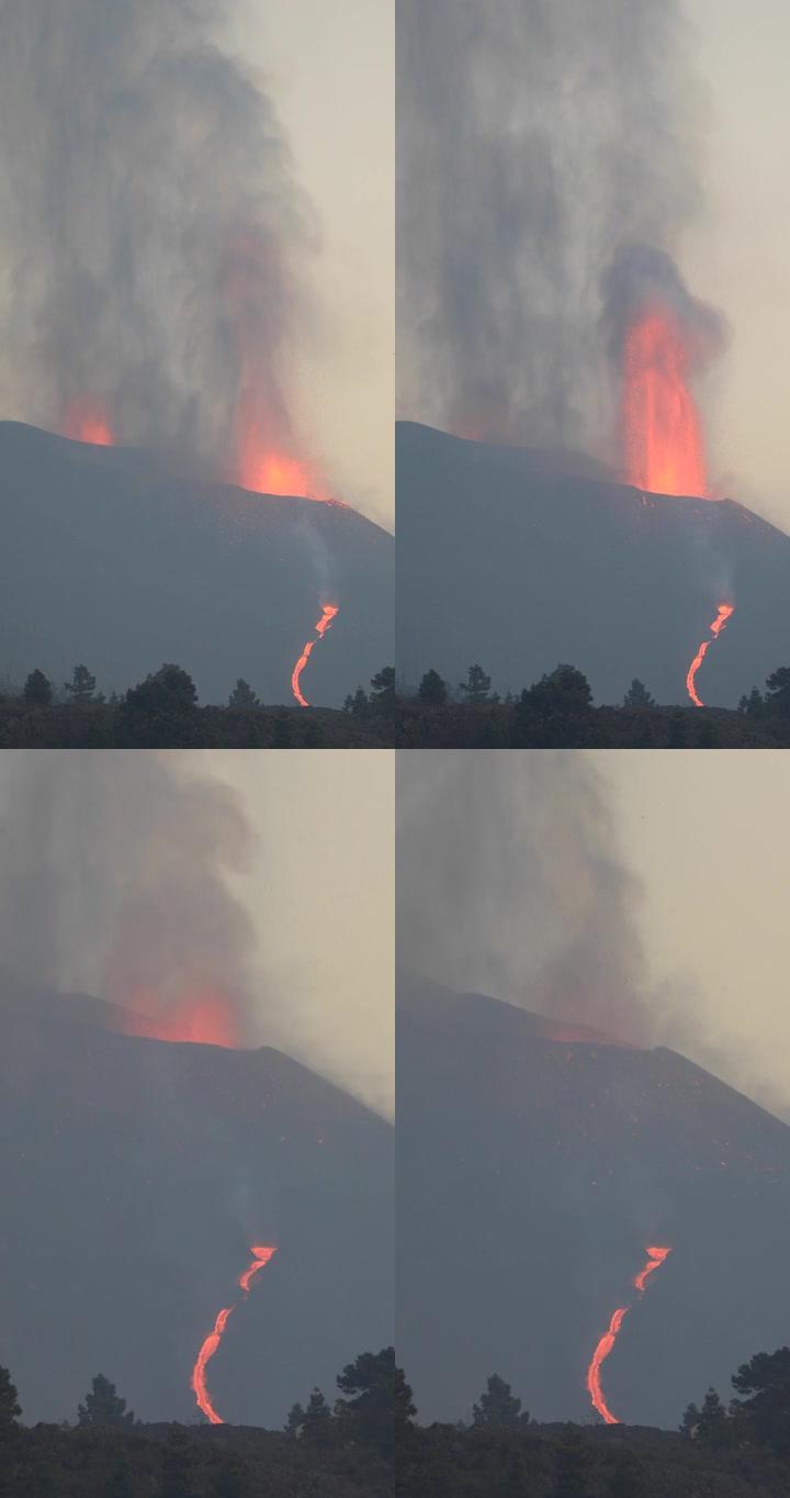 拉帕尔玛火山在黄昏爆发，熔岩流流动。惊人的声音!