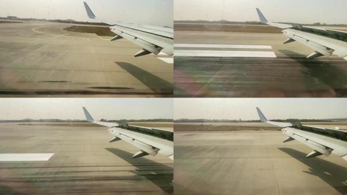 从客机窗口看，降落在机场跑道上的航班