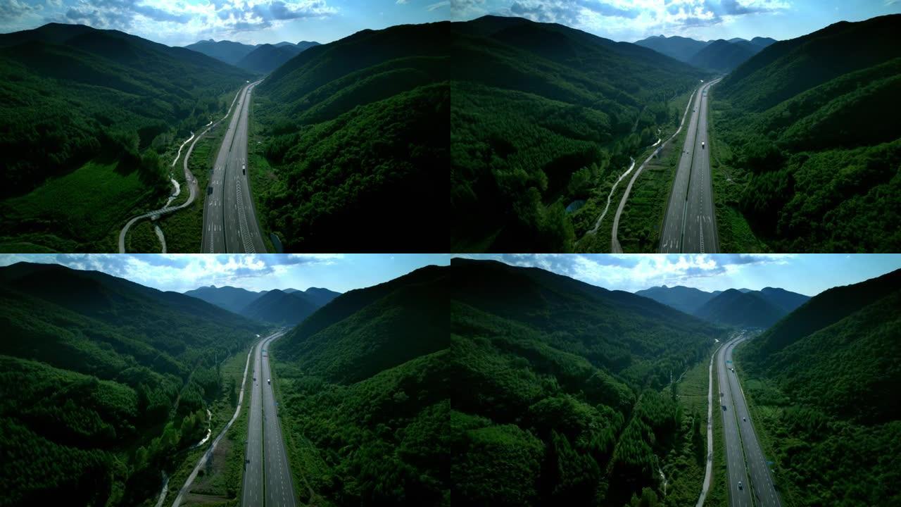 在高速公路上行驶俯视山路山间路车辆跟拍