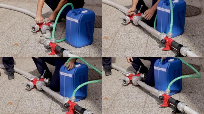 消防员，用消防软管连接和调节水泵