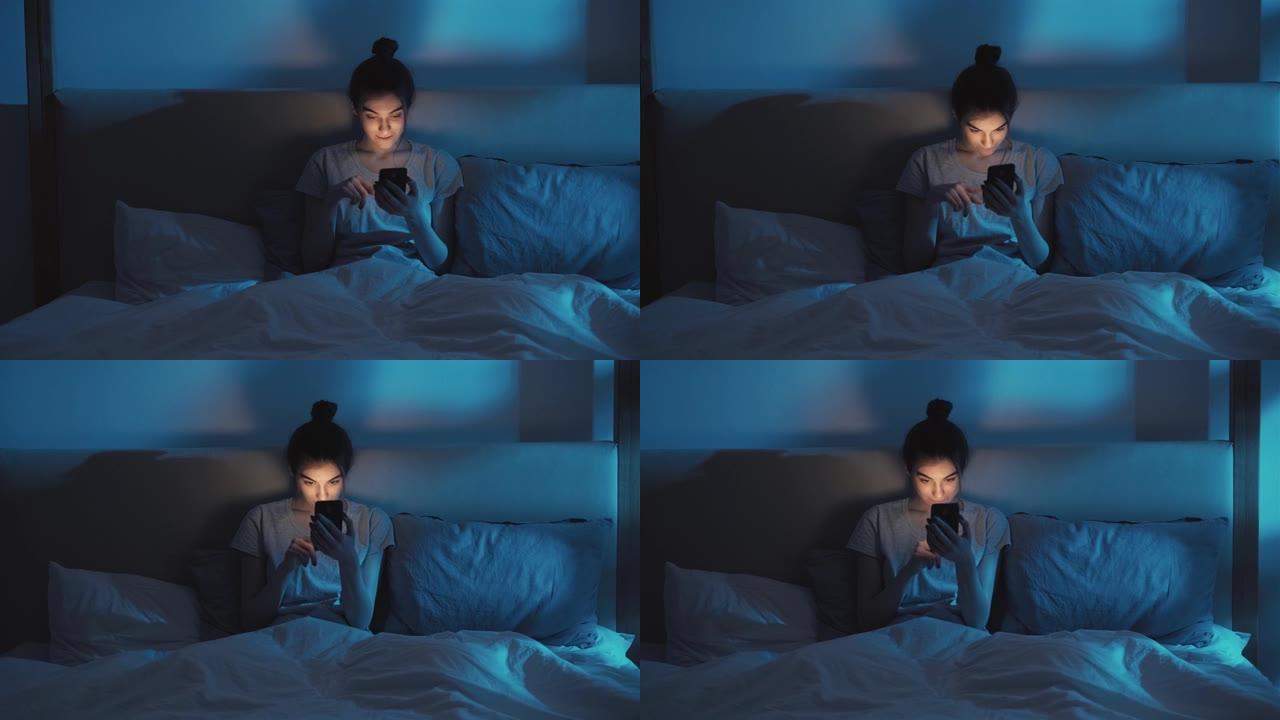 夜间失眠智能手机成瘾女人卧室