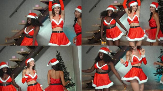 年轻的欧洲，亚洲和非洲女孩穿着红色的新年衣服，戴着帽子在圣诞树上跳舞，微笑着