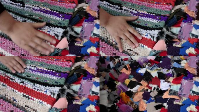 彩色手工制作，传统，摩洛哥地毯，地毯，用织物废料制成。更新无用材料的概念。