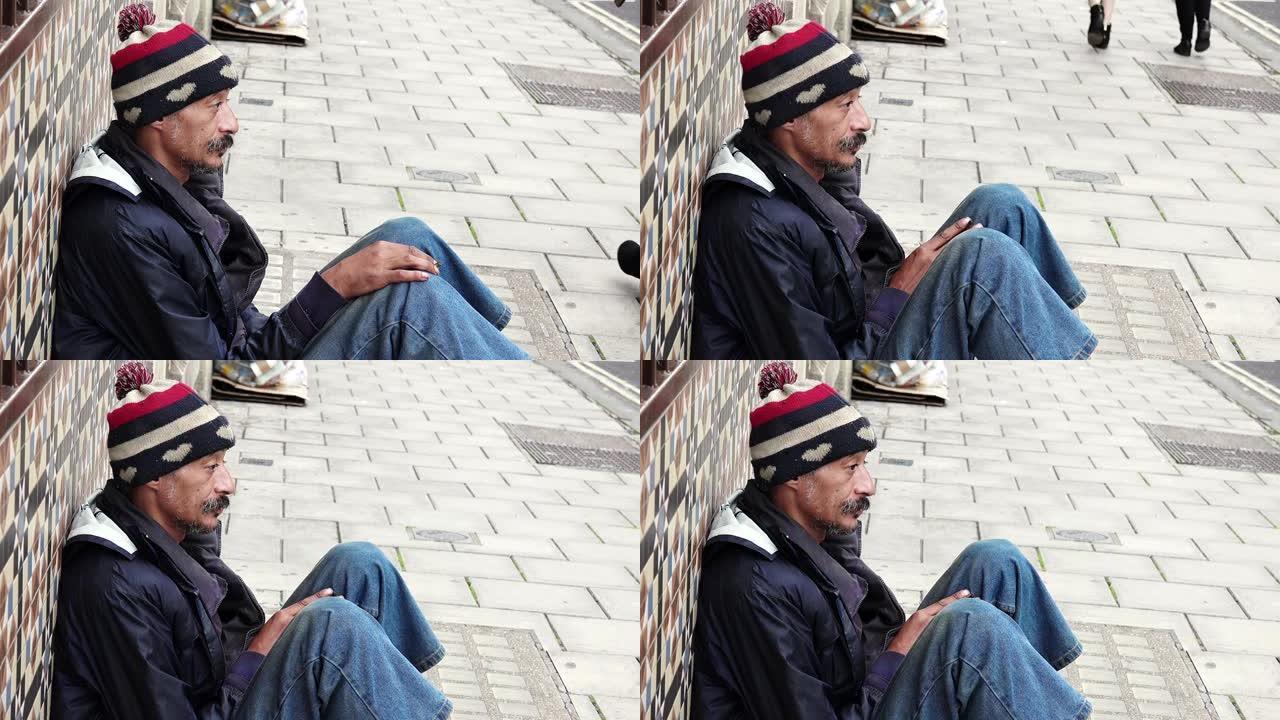无家可归。流落街头的失业乞丐。