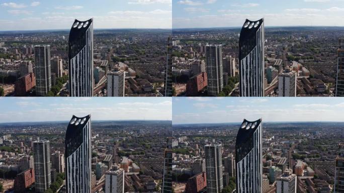 地层摩天大楼的高架视图。大象和城堡的多层公寓楼。风力涡轮机集成到结构的顶部。英国伦敦