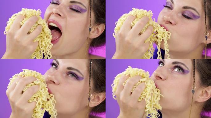 饥饿的女孩正在吃意大利面。