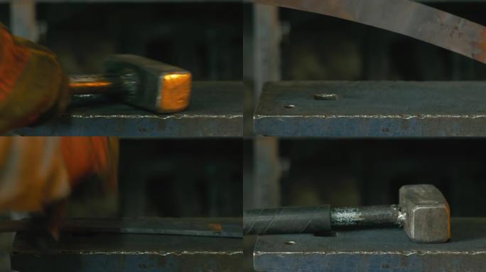 锻造车间。史密斯手工制作。史密斯用锤子的手击中了炽热的金属，铁砧上的锻造过程。