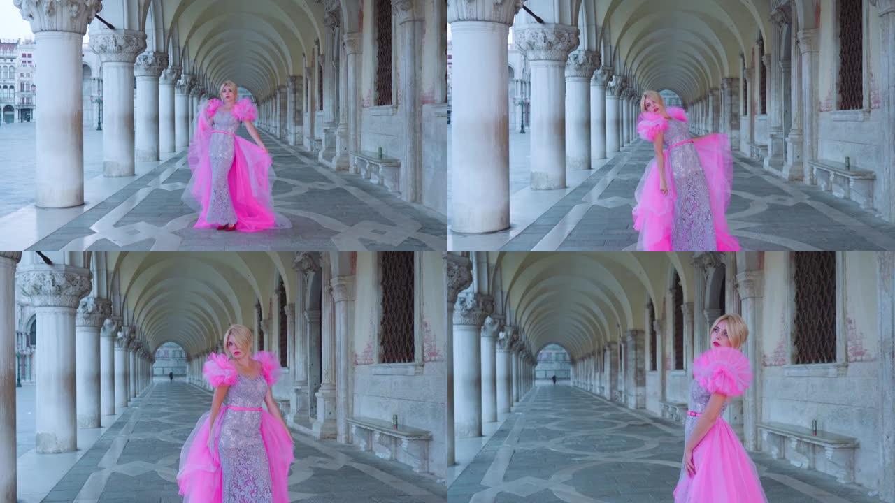 威尼斯隧道中穿着粉红色优雅连衣裙的女孩