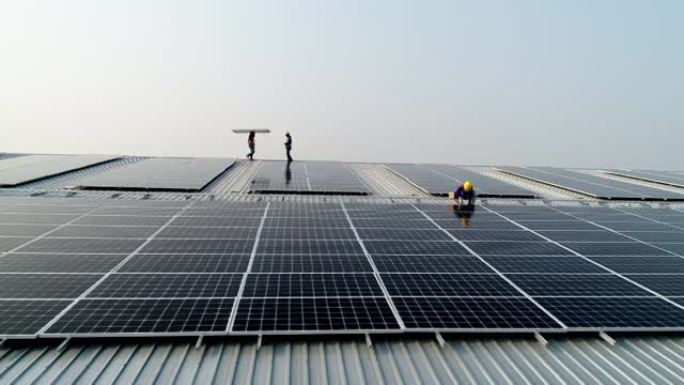 安装太阳能电池板的工人。