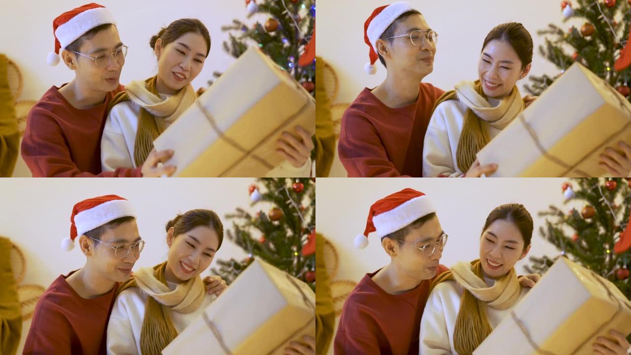 亚洲男人给女朋友送圣诞礼物。