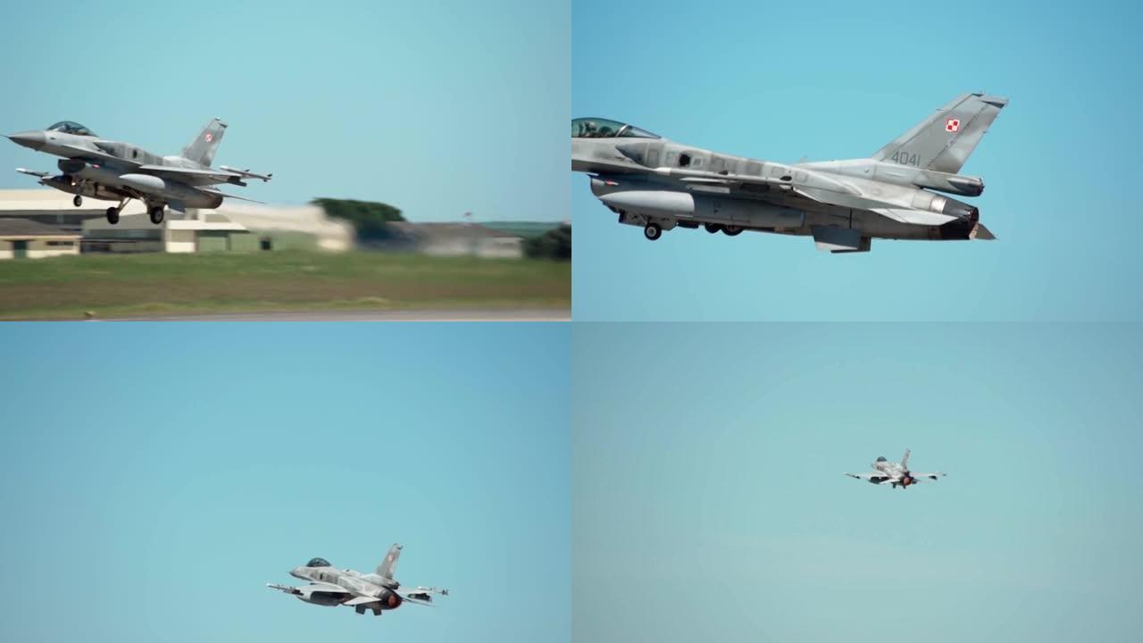 美国F-16军用喷气式战斗机起飞进行战术飞行训练。超音速引擎的消防出口。