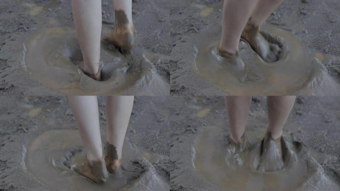 慢动作脚女在海边的沙滩上玩耍