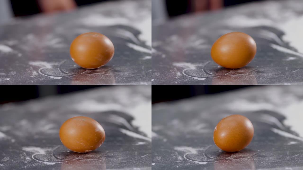 蛋纺。鸡蛋在桌子背景上旋转。复活节快乐
