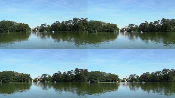 岛上童话城堡的镜头。从漂浮在湖上的小船上看。
