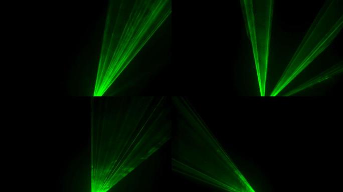 黑色工作室背景上的激光霓虹灯的动态绿色光束在烟雾中旋转和频闪。舞台全息图的展示。假日和派对的照明设备