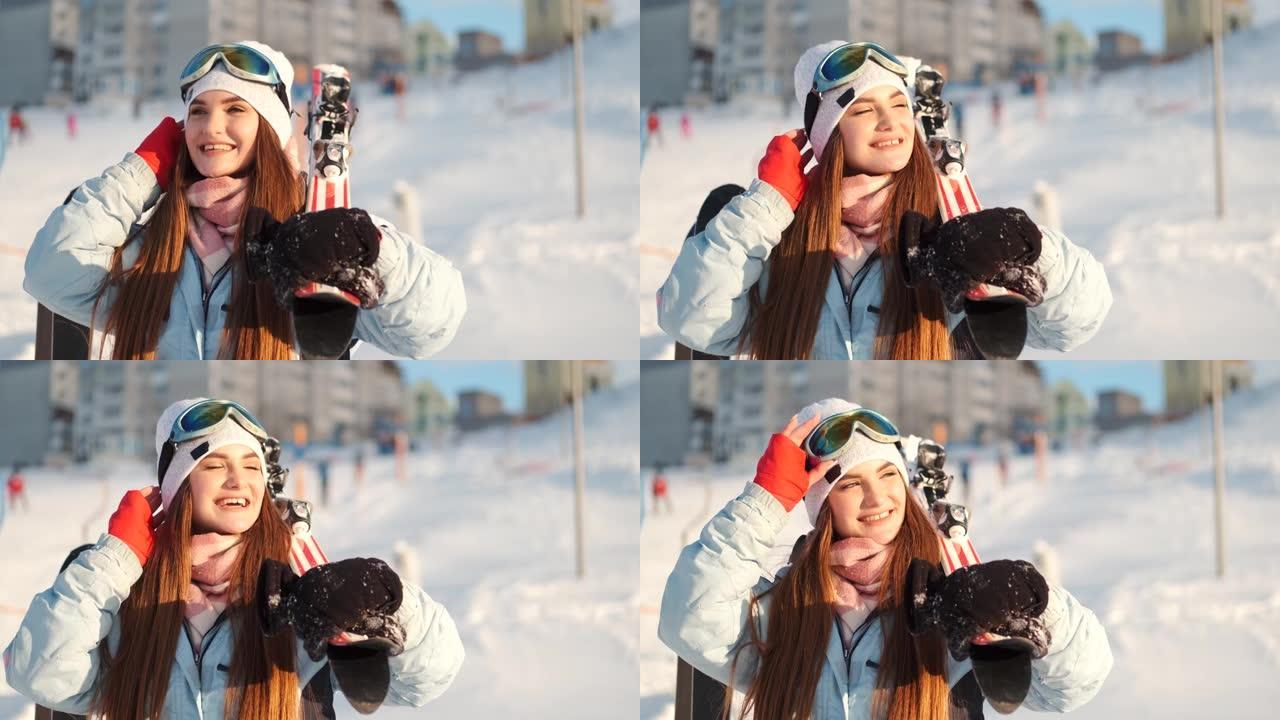 美丽的年轻欧洲妇女在滑雪胜地的设备