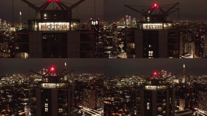 拉回大象和城堡现代高层建筑顶部的镜头。夜景市区全景。英国伦敦