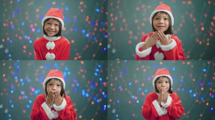 戴着圣诞老人帽子的Aasia女孩跳舞
