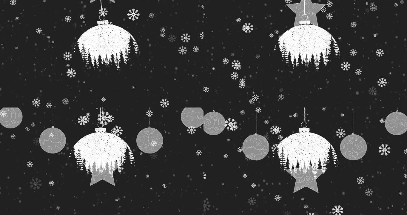 雪花落在黑色背景下的圣诞摆设上