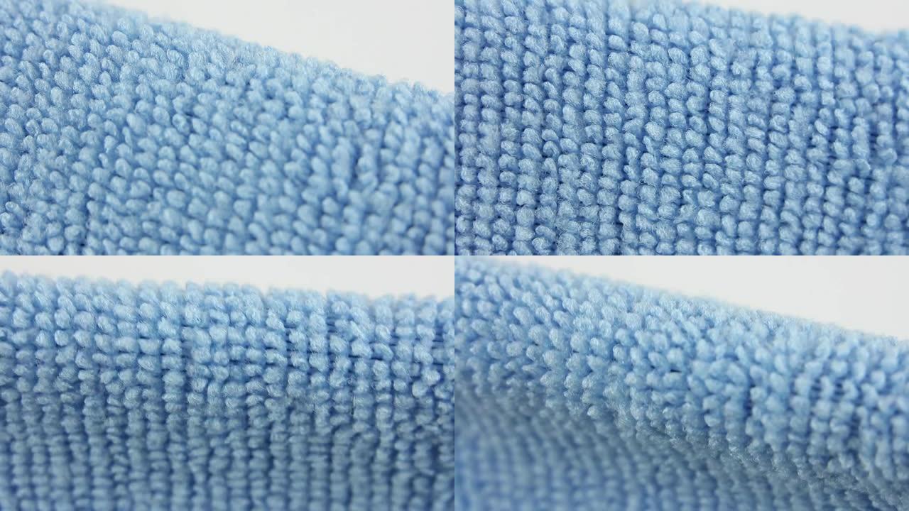 蓝色超细纤维除尘布，吸水性良好的合成纤维织物，纺织品质地的特写宏观视图