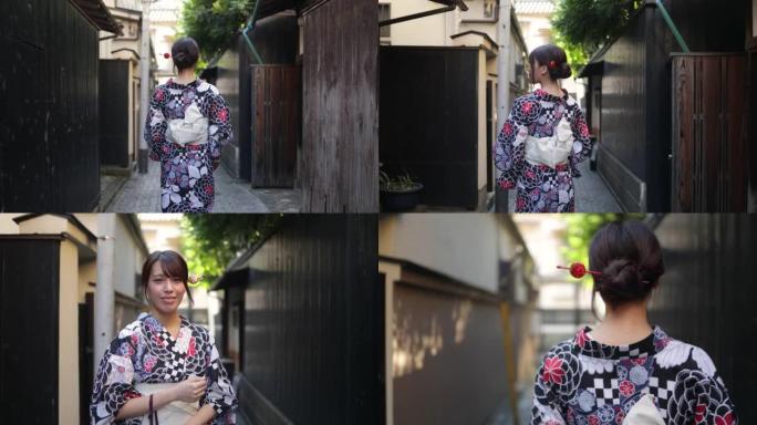 日式浴衣的日本妇女走在狭窄的道路上 -- 后视图和抬头看