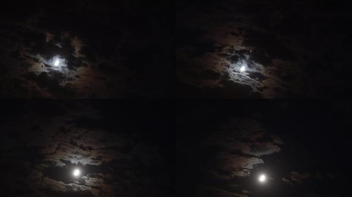 半月形在黑色黑暗的夜空中移动的时间流逝。