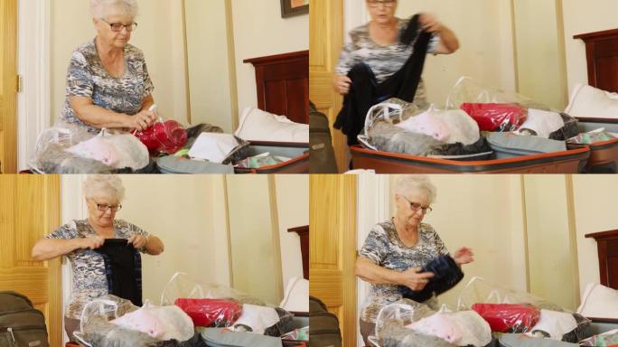 老年妇女使用可重新密封的塑料袋包装行李箱，以防止臭虫侵扰
