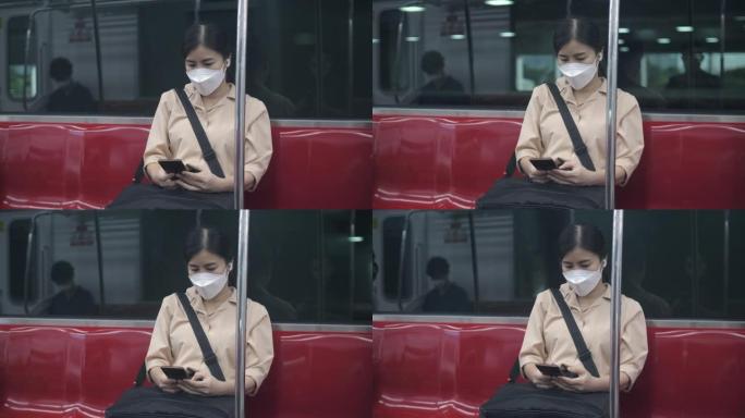 年轻女子戴着无线耳机，在火车上旅行时做工作