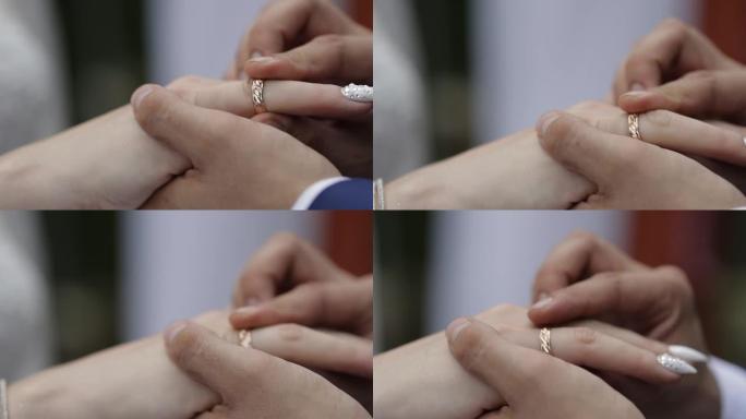 新郎戴上新娘的结婚戒指，一个紧密的计划