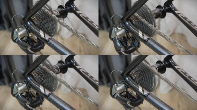 自行车轮毂、轮辐、齿轮和链条的旋转运动。齿轮系统和自行车车轮。自行车传动系统链盒和辐条。金属轮辐条正