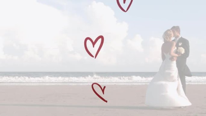 白种人夫妇穿着婚纱并在海滩上接吻的红心动画