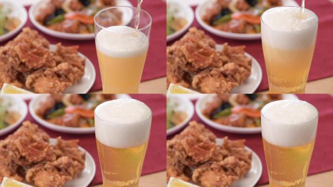中国菜和生啤酒在桌子上一字排开。