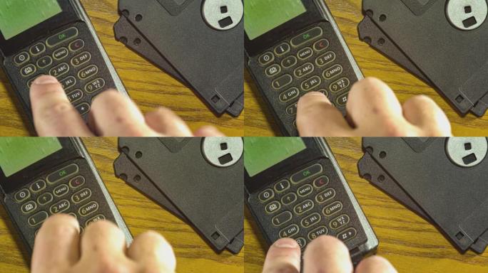 使用80年代90年代的复古手机按钮细节和软盘。