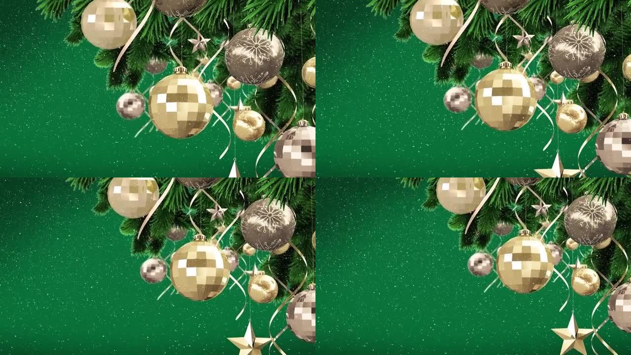 绿色背景上的树上的圣诞节小玩意上的雪的动画