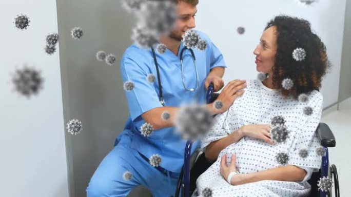 男性医生与孕妇坐在轮椅上的冠状病毒细胞的动画