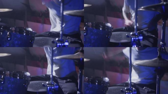 一名职业男艺人演奏鼓包。