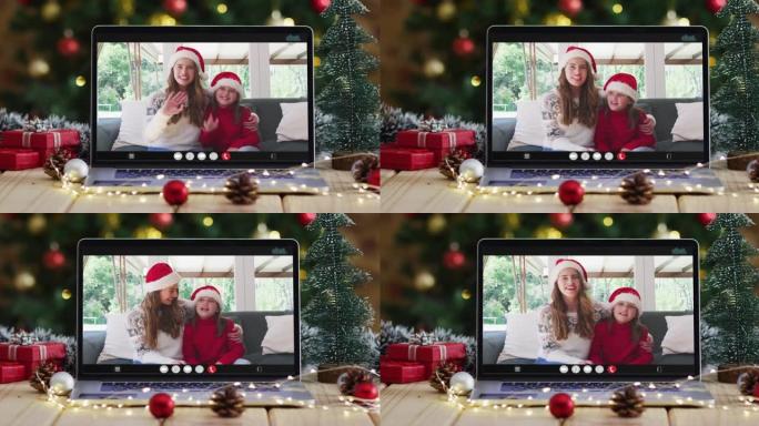 快乐的母女在笔记本电脑上进行视频通话，带有圣诞节装饰和树木