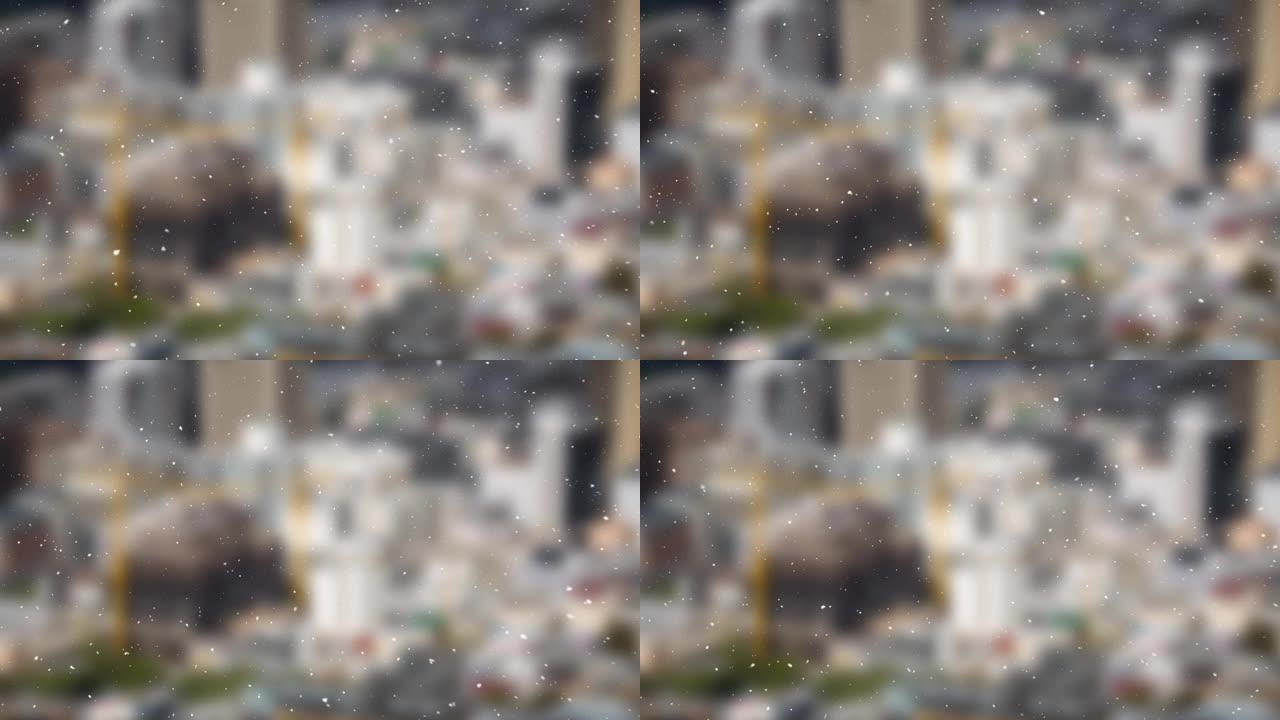 背景中的雪粒落在城市景观的模糊视图上
