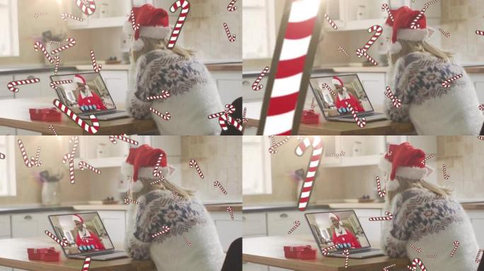 圣诞节在笔记本电脑视频通话中，糖果手杖掉落在圣诞老人帽子上的白人妇女的动画