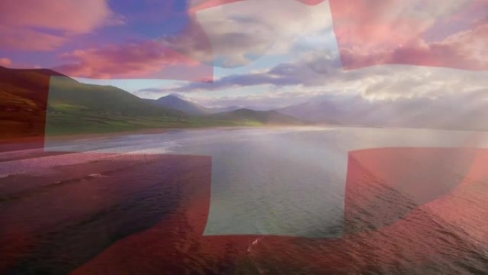 丹麦国旗的动画在海滩景观，大海和多云的蓝天上飘扬