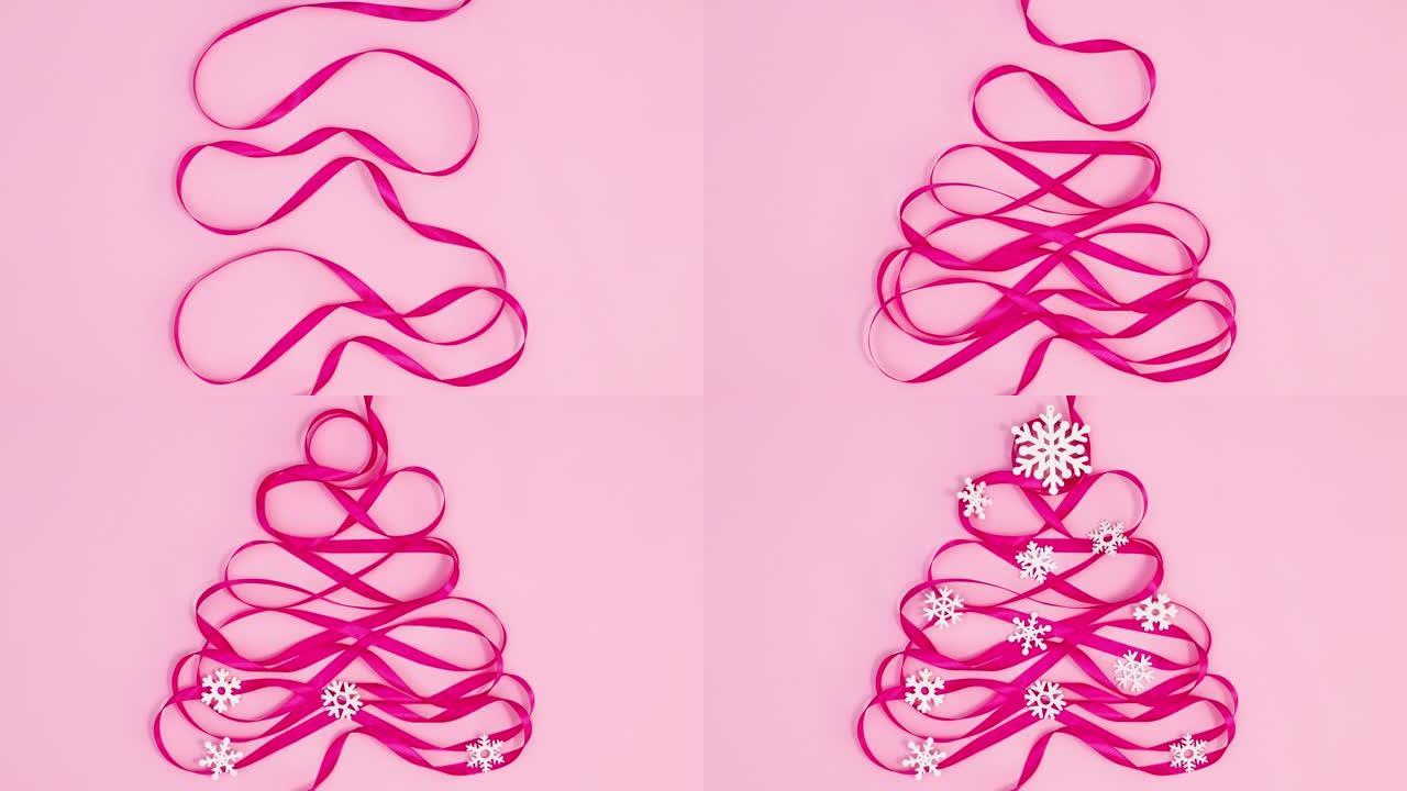 粉红色带雪花的圣诞树制作粉红主题。停止运动